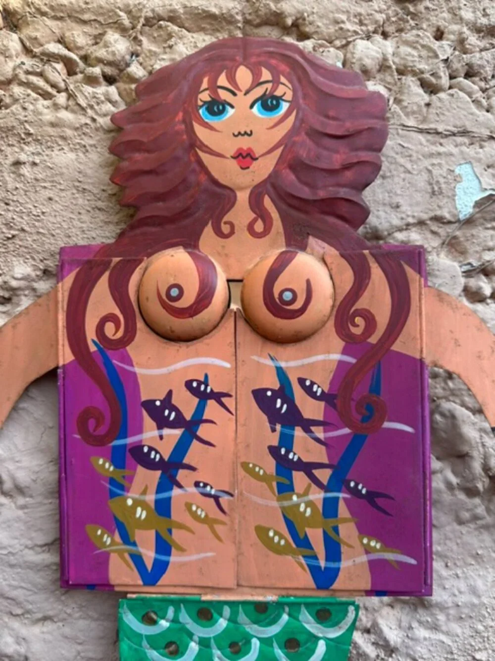 Redheaded painted tin mermaid with chest drawers that open to a mirror.